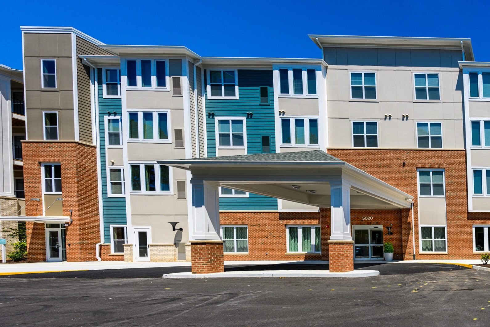 Modern Multifamily Residential Building with Covered Entrance