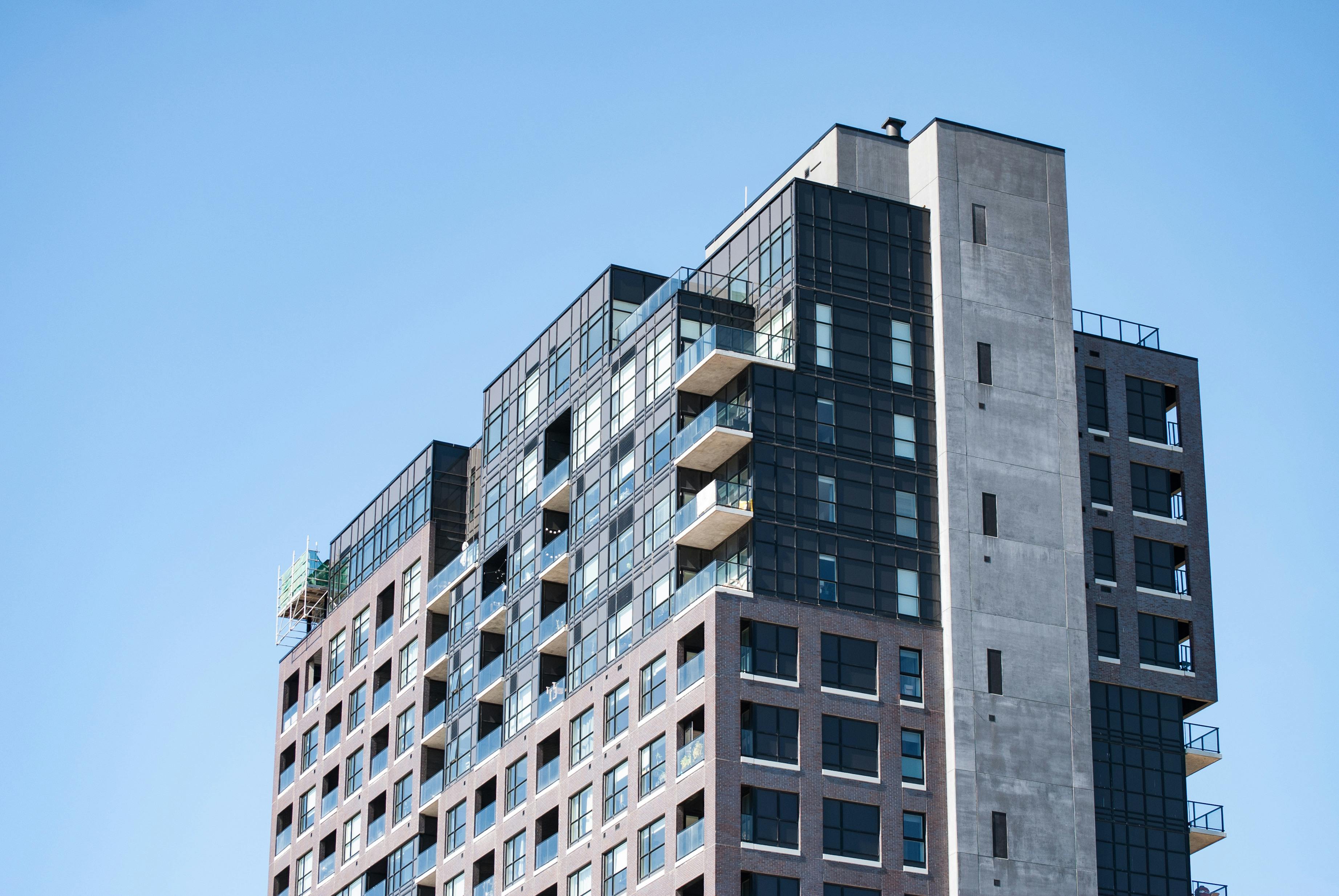 Modern High-Rise Apartment Building Under Clear Sky